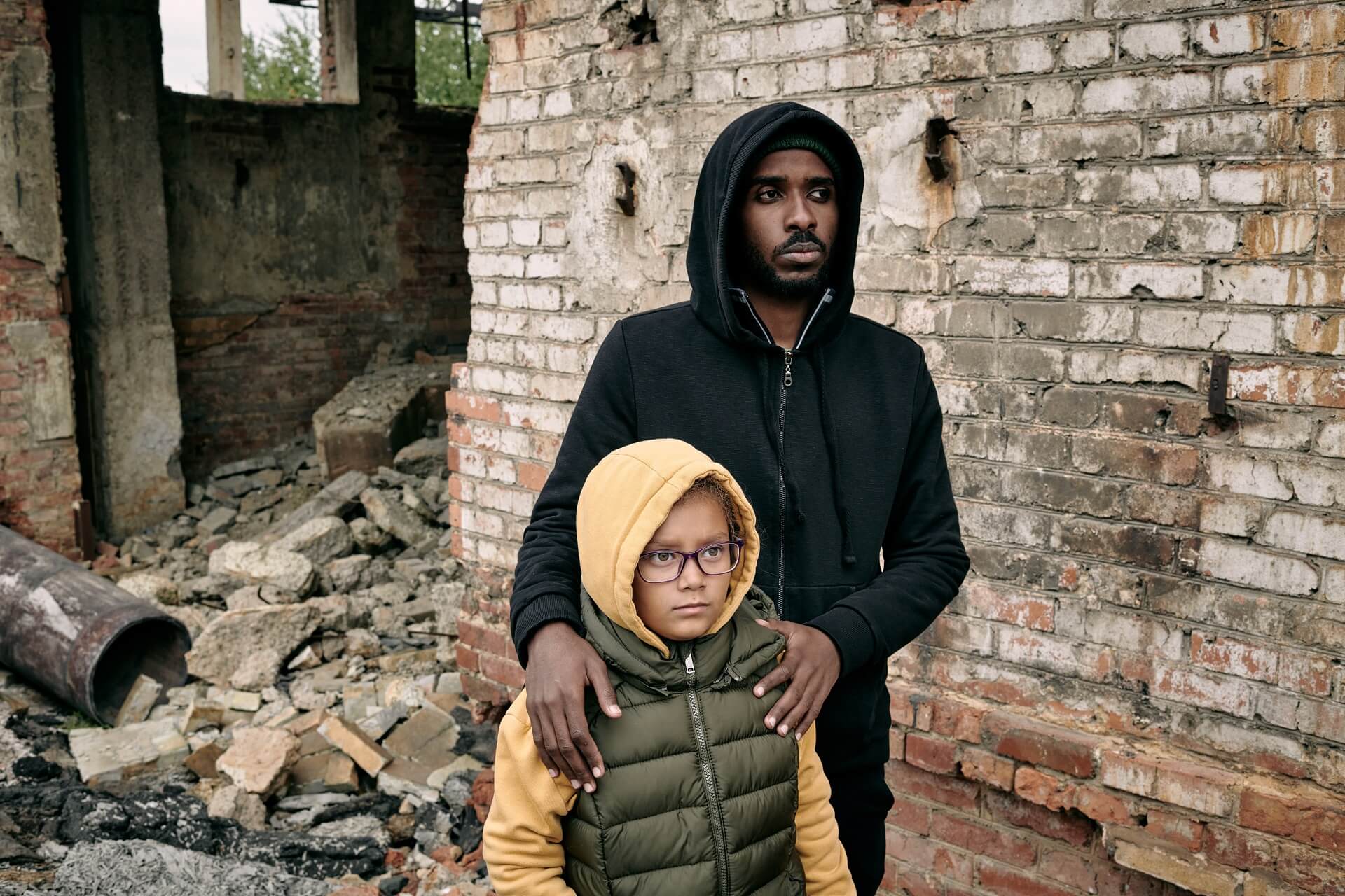 black-man-with-daughter-at-ruined-house-2021-09-24-02-52-21-utc (1)